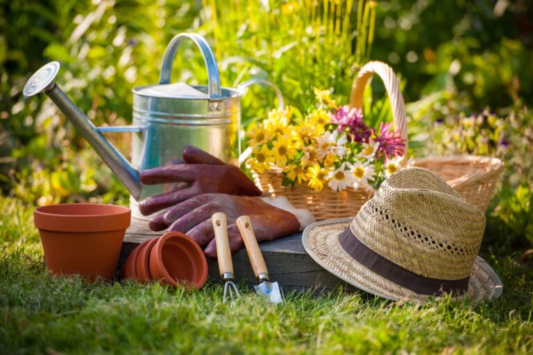 Gardening tools in a lush garden.