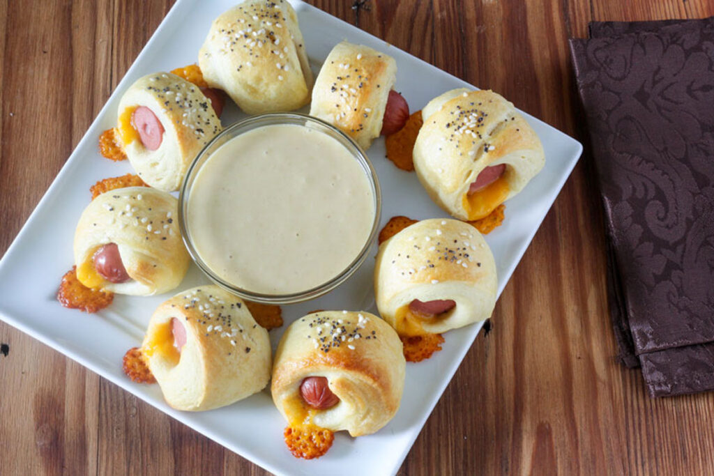Pigs in a blanket with dipping sauce.