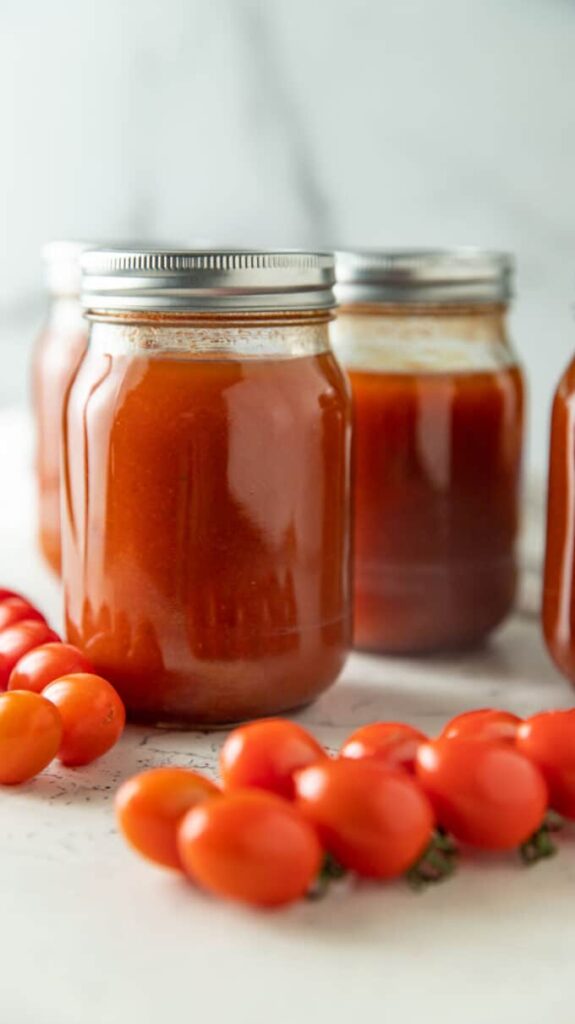 Four jars of tomato soup.