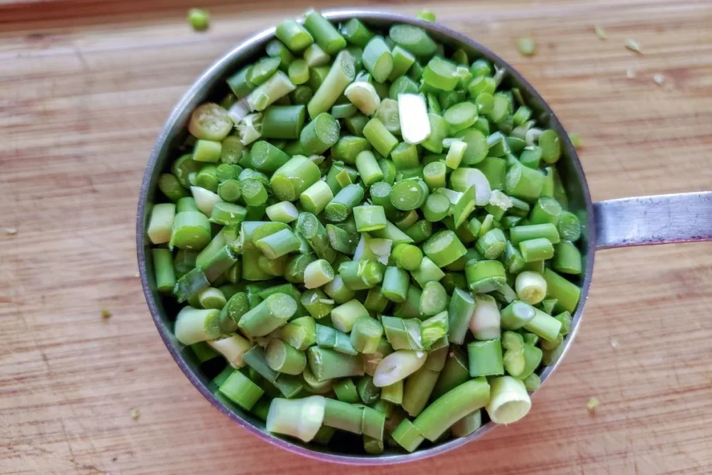 Finely chopped garlic scapes.
