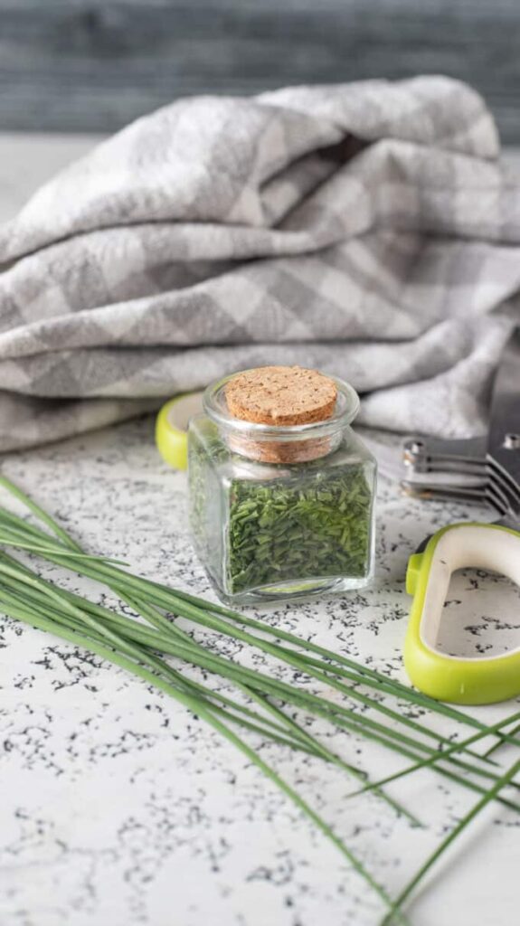 Dehydrated chives in spice jar.