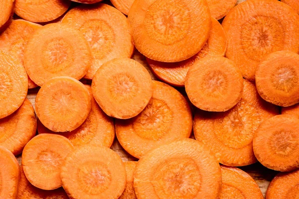 Top view of fresh ripe carrot slices.
