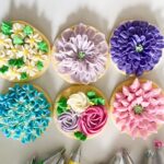 An overhead shot of six spring flower cookies