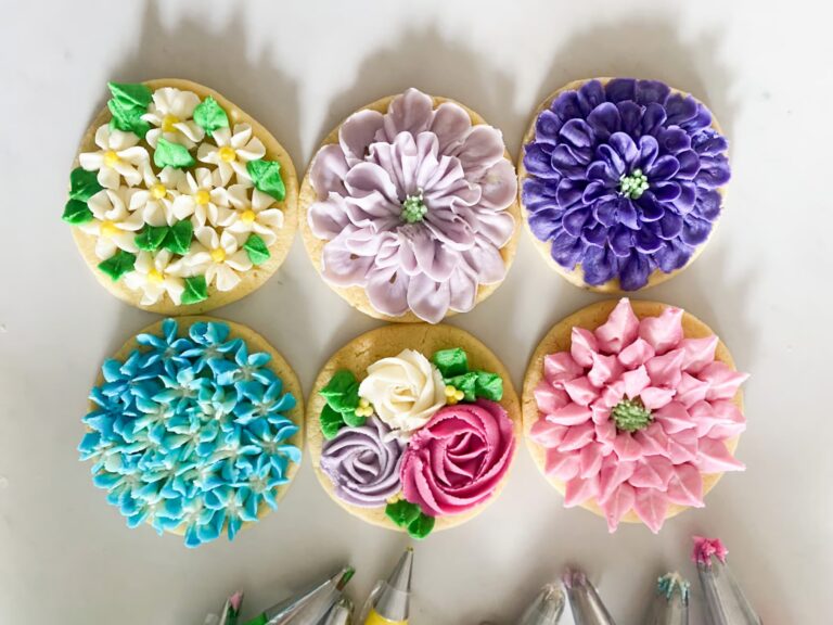 An overhead shot of six spring flower cookies