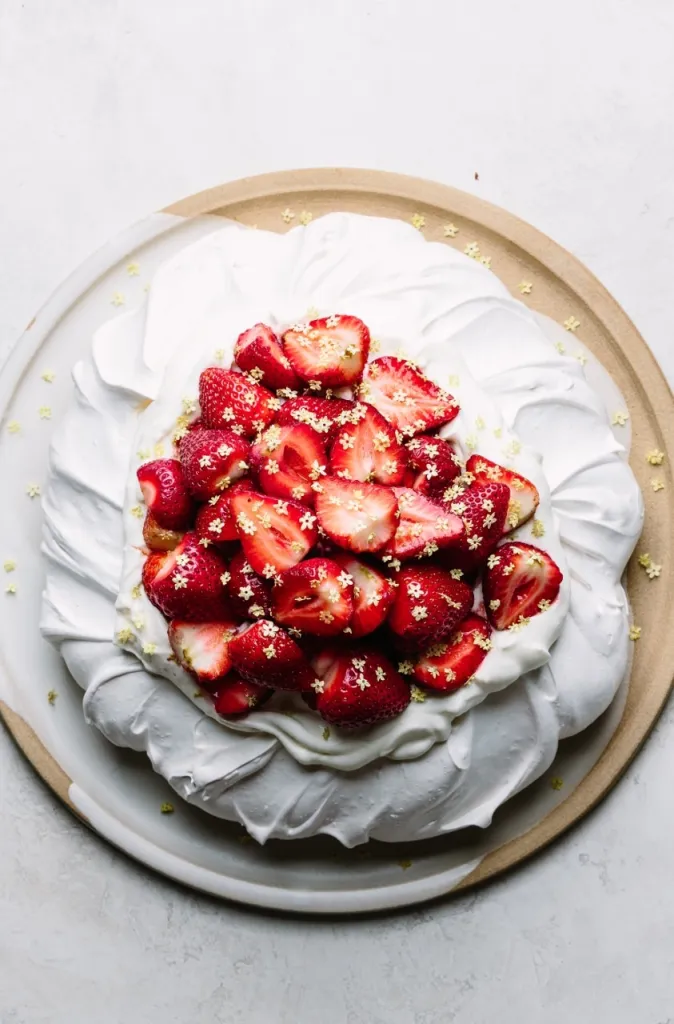 An overhead shot of strawberry elderflower pavlova.